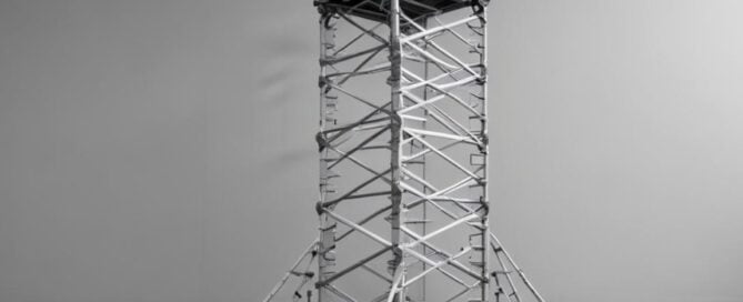 a metal tower with wheels
