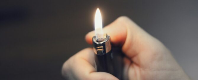 a hand holding a lighter