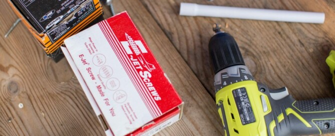 a drill and box on a table