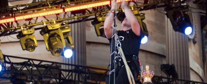 a man climbing a rope