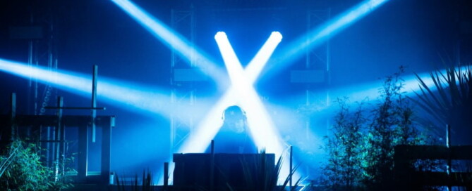 a person on a stage with blue lights