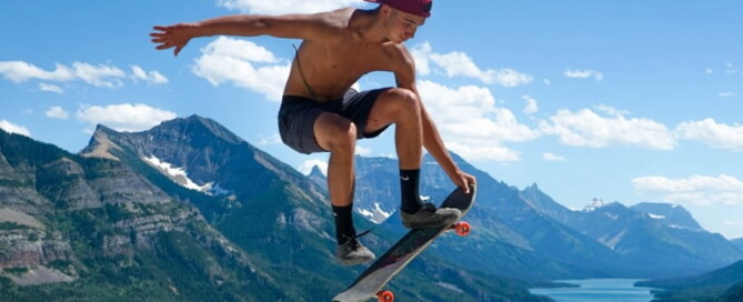 a man jumping in the air with a skateboard