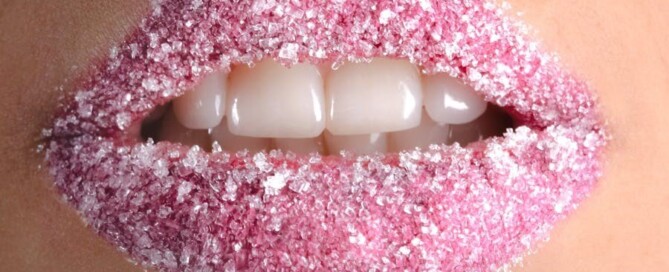 a close up of a lips with sugar on it