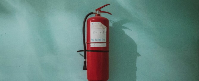 a fire extinguisher on a wall